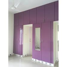 Fashionable hats, beautiful pink and red dresses hanging in wardrobe. Purple Wooden Bedroom Wardrobe Rs 600 Square Feet M Vijayalakshmi Id 22318008297