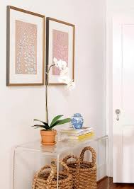 Seagrass Baskets Tucked Under Clear Acrylic Console Table Transitional Entrance Foyer C In 2020 Console Table Styling Console Table Decorating Acrylic Side Table