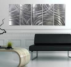 This wall art, which comes spread across three canvases, transitions from black and white to a colored design. Amplify Silver Modern Metal Wall Art Contemporary Wall Sculpture Modern Wohnbereich Miami Von Jon Allen Fine Metal Art Houzz