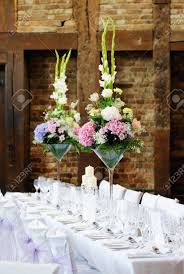 The right floral arrangements can transform your reception. Wedding Reception Flower Arrangement With Pink And White Decoration On Table Stock Photo Picture And Royalty Free Image Image 21956602