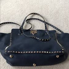 Valentino garavani rockstud studded flat navy patent leather clutch bag $1295. Valentino Bags Valentino Medium Grain Leather Rockstud Bag Poshmark