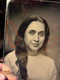 What causes artifacts in wet plate collodion photography?