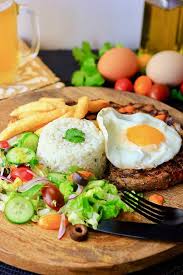 Bitoque Grilled Steak Or Pork With Fried Egg French Fries Rice And Salad Portuguese Recipes Dinner Time Travel Food