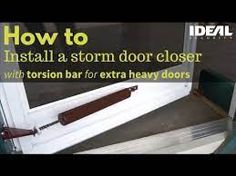 It is installed on the same side as the door hinges and keeps the storm door from slamming when it is closed. How To Install Or Replace A Storm Or Screen Door Closer Heavy Door Closers With Torsion Bars Youtube