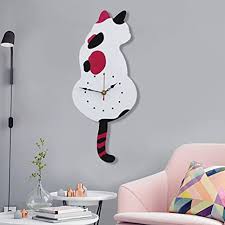 Is it safe to hang pictures above a bed. Amazon Com Ukey Wall Clock Creative Diy Cat Acrylic Wall Clock With Swing Tail Pendulum For Living Room Bedroom Kitchen Home Decor Battery Not Included 42cm X 18cm White Home Kitchen