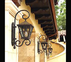 Open and charming like a southern home. Wrought Iron Exterior Wall Lights Beautiful Chandeliers Iron Lighting Outdoor Wall Mounted Lighting Outdoor Light Fixtures