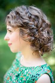 This wedding hairstyle for long hair is called waterfall braid is an interesting version of an ordinary down style. Untamed Tresses Naturally Curly Wedding Hairstyles