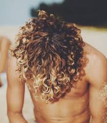 Firstly, what you need to know about them is that they're not any style of those haircuts can make your blonde hair look in a very fashionable way. A Photograph Of Jay Alvarrez With His Cool Curly Hair In A Surfer Hairstyle With Blonde Highlights Man Bun Hairstyle