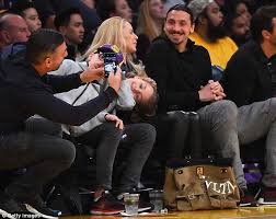 Zlatan ibrahimovic gleefully poses with fan's 'shag my wife' sign. Zlatan Ibrahimovic Continues His Tour Of La Sport With Nba S Lakers Express Digest