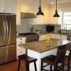 The layout of this l shaped kitchen interior design paired with white subway tiles visually gives the impression of having more space. 1
