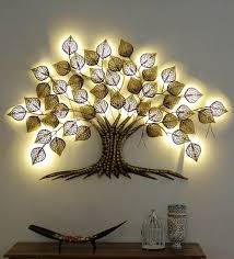 If the concrete block wall is painted and has a relatively smooth—not porous—finish, hanging pictures may be as simple as installing removable adhesive wall hooks. Gold Iron Big Led Tree By Sugandha Led Wall Art Metal Tree Wall Art Metal Wall Hangings