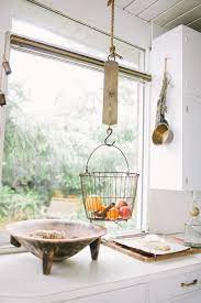With the right kitchen wall basket, you can keep cooking necessities out of sight and freshly preserved. Design Sleuth The New Fruit Basket Remodelista Hanging Fruit Baskets Home Kitchens Kitchen Inspirations