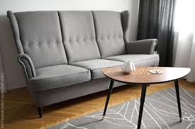 Ikea Strandmon Svanby Grey Three Seat Sofa Lovbacken Side Table And Gislev Rug Wing Chair Sofa Three Seat Sofa Couches Living Room