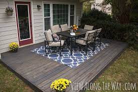 Maybe you would like to learn more about one of these? Diy Deck Over A Concrete Patio And Tips For Staining Your Deck The Easy Way Love The Color Diy Concrete Patio Concrete Patio Patio Design