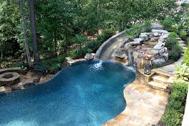 Outdoor pools are situated in your backyard and offer very little to no shelter. Pool With Slide Waterfall Grotto Cave Pool Backyard Pool Dream Pools