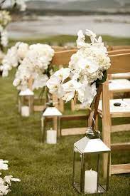 Check out this wedding flower checklist for all the other times you might the bouquet is an arrangement of flowers that the bride carries down the aisle and holds during portraits. Laterns Down The Isle Wedding Aisle Decorations Wedding Aisle Outdoor Lanterns Wedding Aisle
