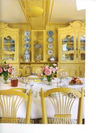 Beach finds, such as a giant conch shell, pebbles. Monet S Yellow Dining Room Yellow Dining Room French Country Decorating Yellow Cottage