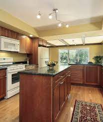 The following ideas show how white cabinets can make your kitchen more visually interesting. 65 Kitchens With White Appliances Photos White Kitchen Appliances White Appliances Kitchen Black Counter