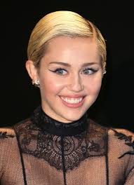 The musician and actress showed off her new 'do while shooting in new york recently. Miley Cyrus Is Back To Her Hannah Montana Long Blonde Hair Teen Vogue