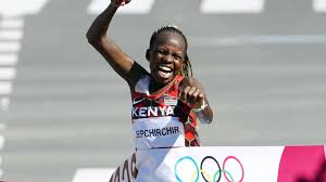 Peres jepchirchir of team kenya celebrates as she crosses the finish line to win the gold medal in the women's marathon final on day fifteen of the tokyo 2020 olympic games at kasumigaseki country club on august 07, 2021 in kawagoe, japan. S Yujncc Ep3um