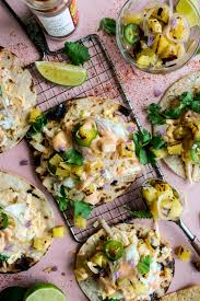Three homemade corn tortillas, grilled tilapia, shredded cabbage, pico de gallo and avocado crema. Grilled Fish Tacos With Pineapple Salsa Chile Mayo The Original Dish