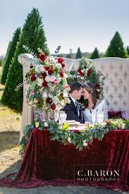Wedding Sweetheart Table Decor Our High Back Loveseat Burgundy Crushed Linen Gold Candelabra With Wedding Table Linens Sweetheart Table Wedding Wedding Table