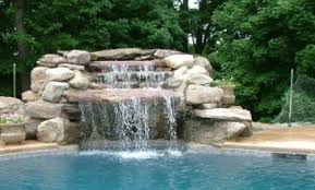 The pool into which the water falls and the cascading structure for the waterfall itself. Waterfall Installation Pool Services In Elkhart In