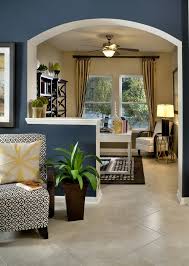 Love The Half Wall To Slightly Separate The Home Office From The Living Space Great Wall Color Brown Living Room Decor Brown Living Room Walls Room