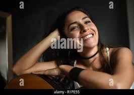 Female Jazz Singer, studio portrait with vintage microphone Stock Photo