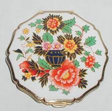 Powder compact/cigarette case/lipstick this magnificent powder compact and hand mirror beauty set are in excellent vintage condition throughout vintage quality gold plated powder compact made in switzerland. Vintage Stratton Enamel Enamelled Imari Vase Floral Powder Compact