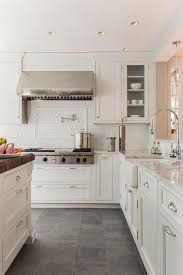 Creamy White Cabinets Paired With Supreme White Quartzite Countertops Venegas And Company Grey Kitchen Floor Kitchen Floor Tile Slate Kitchen