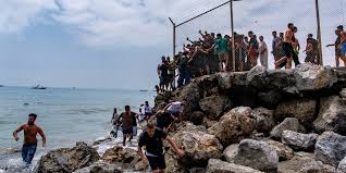 Absolute chaos' as thousands of people breach Morocco's border with Spain