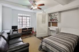 The maple wood has a light rosy stain that compliments the parquet oak floor. What You Need To Know About Apartments That Have Murphy Beds To Save Space