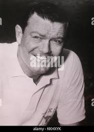 Texas football coach Darrell Royal and Tennessee coach Doug Dickey, right,  have a laugh during a joint news conference in Dallas, Dec. 30, 1968. Their  teams will meet in the Cotton Bowl