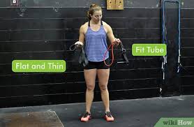 Next, approach the barbell rack and carefully place the bar across. 5 Ways To Do Squats With A Resistance Band Wikihow Fitness