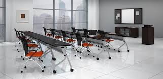 This Modern Training Room Features Mayline Sync Tables That Flip And Nest For Easy Storage Along With Maylin Office Interiors Modern Office Interiors Furniture