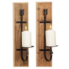These beautiful teak candle holders hold a standard taper candle, and will provide a warm, comfortable appearance that will accent other furnishings anywhere they are displayed. Candle Sconce Wall Sculptures Wall Accents The Home Depot