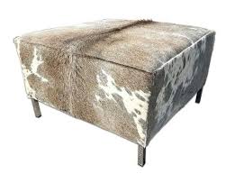 This versatile piece is a table, ottoman, and storage unit all in one. Hairon Cowhide Table Grey Brindle Cowhide By Cowhidesusa On Etsy Cowhide Furniture Cowhide Ottoman White Ottoman