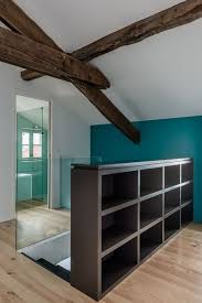 Une Bibliotheque Anthracite Pour Livres De Poche Derriere Le Garde Corps By Bettye Attic Renovation Loft Room Home