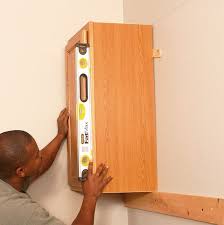 Are you worried about how to hang kitchen cabinets in your kitchen? How To Install Kitchen Cabinets Hometips Installing Kitchen Cabinets Installing Cabinets Kitchen Wall Cabinets