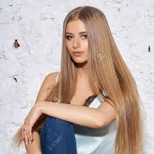 We're so right, we're skintight, and i'll be with her tonight. Young Beautiful Woman With Long Straight Blonde Hair In Blue Stock Photo Picture And Royalty Free Image Image 103354968