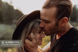 Romantic mid adult man kissing girlfriend