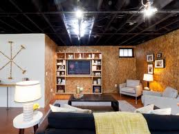 Industrial Living Room With Exposed Ceiling And Unfinished Walls Basement Living Rooms Living Room Ceiling Industrial Livingroom