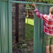 The type of fencing i want is. Construct A Colorbond Fence In Your Garden Better Homes And Gardens