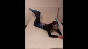 Mermaid Fin and Wetsuit playing