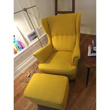 The back cushion can be moved around to fit your sitting. Ikea Strandmon Yellow Armchair Ottoman Aptdeco