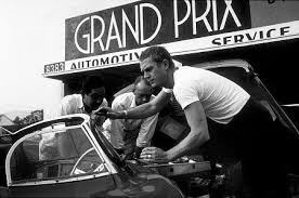 Grand prix, a british motorsports drama film; Steve Mcqueen With His Xkss Jaguar At Grand Prix Motors On Melrose Ave Steve Mcqueen Mcqueen Steve Mcqueen Style