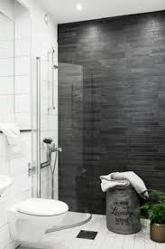 Total gray afterward white and see how soft and soothing your. K54 Apartment A Stylish Apartment Designed With Black White And Modern Interior Bathroom Feature Wall Dark Grey Tile Bathroom Gray And White Bathroom
