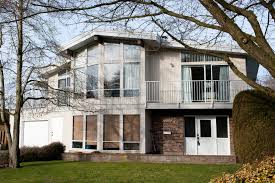 Change typical builders wrought iron railing with something more current, even build a knee wall separating lr from entry Remodeling Ideas For A Ho Hum Ranch Style House