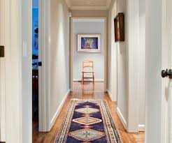 Emily bartlett photography design ideas for a contemporary hallway in melbourne with white walls, light hardwood floors and beige floor. 7 Diy Cures For The Claustrophobia Caused By Long Narrow Hallways Designed